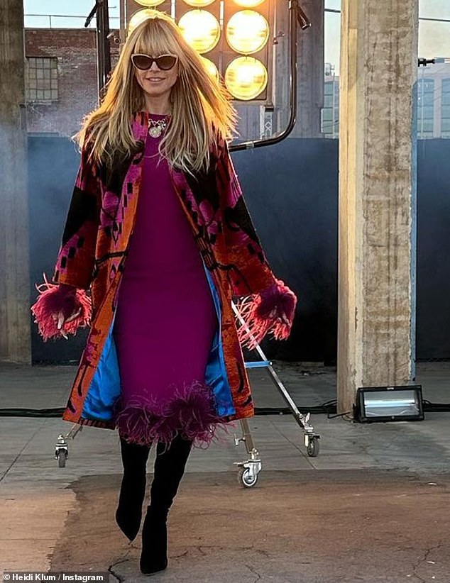 Showing off her stuff: The model, 49, wore a purple dress and colorful coat in another promo for GNTM