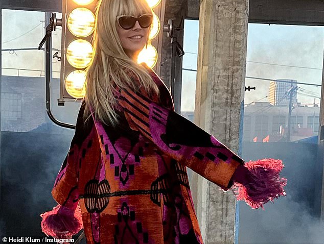 Coat of many colors: Heidi wore her hair long and donned sunglasses for the photo shoot