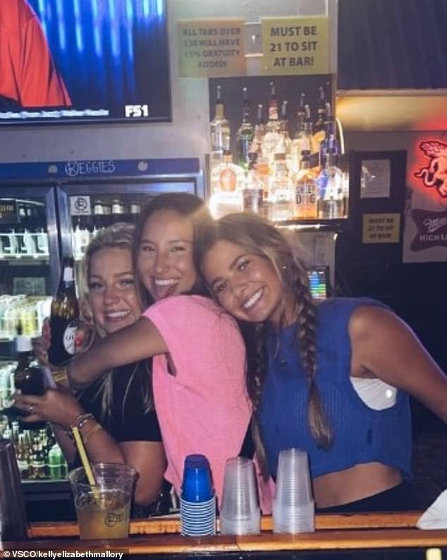 Madison Brooks (left) seen behind the bar at Reggie's with two sorority sisters.  She had been drinking at the bar before she was fatally raped and struck by a car on January 14.