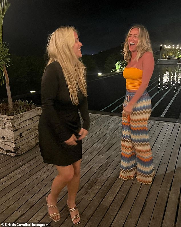 Always having fun: Kristin and her BFF Steph laughed as they enjoyed an evening together outdoors near a large pool.