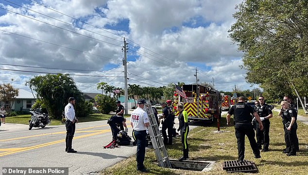 Kennedy seemed to want no help.  She ignored the police upon her arrival and fled down the storm drain.  In the photo: Firefighters rescuing Kennedy