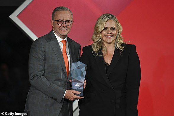 Taryn Brumfitt receives the Australian of the Year award from Prime Minister Anthony Albanese in Canberra on Wednesday.