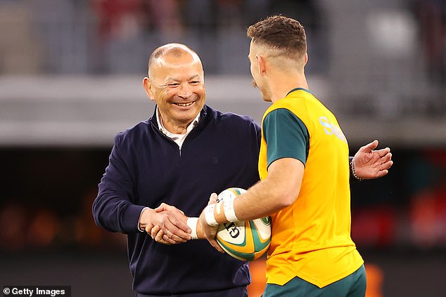 Nic White shakes hands with Eddie Jones before Australia played England in July last year