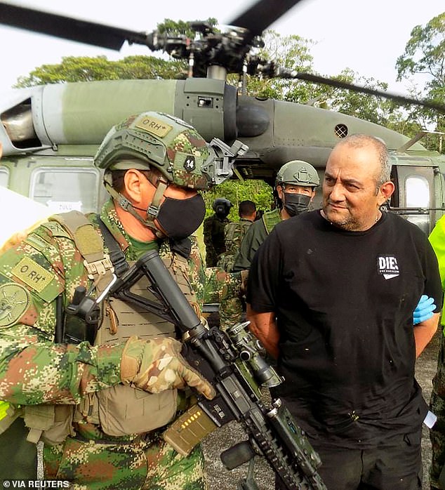 Dairo Antonio Úsuga David, aka "Othniel"Top leader of the Clan del Golfo, is escorted by the Colombian military after being captured, in Turbo, Colombia, October 23, 2021