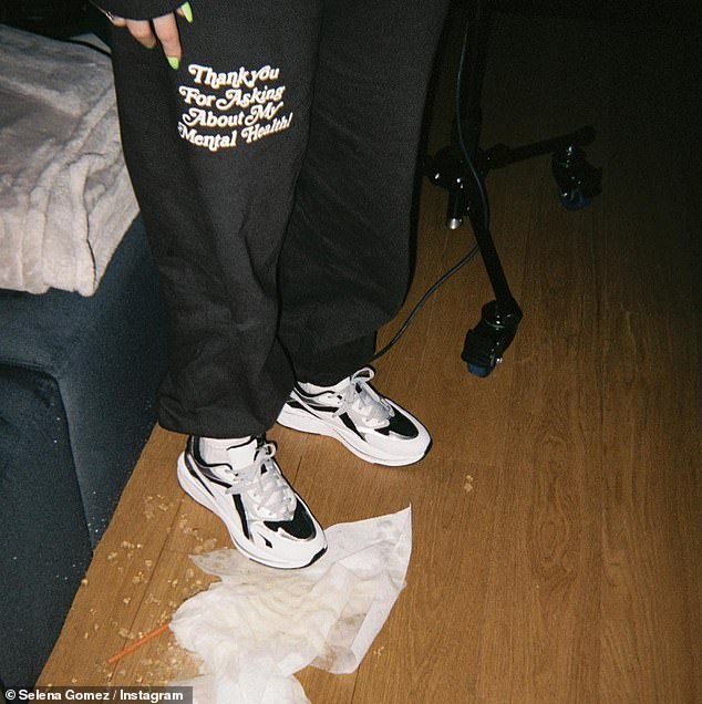 Second photo: A second snapshot showed a person wearing black Mayfair Group sweatpants with black and white trainers.