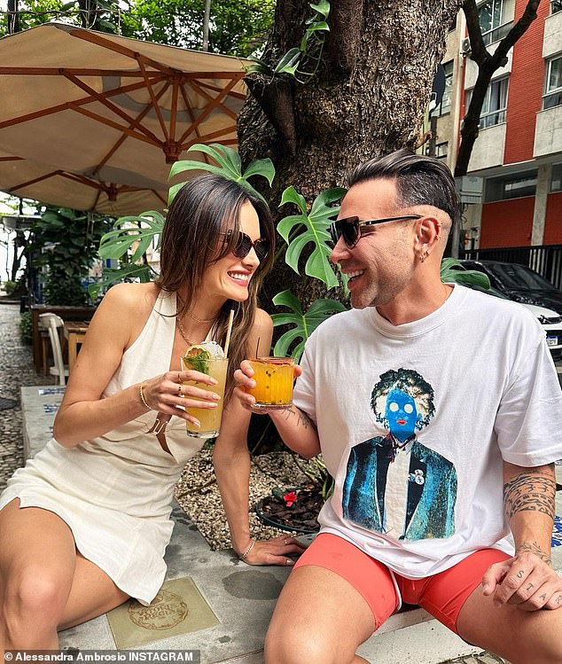 Lunch date: In a series of snaps released on Wednesday, Alessandra was seen enjoying food and drinks with activist/artist Matheus Mazzafera.