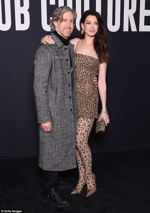 Chic Couple: The Devil Wears Prada star exuded a chic appeal in her leopard print stilettos and even carried a matching clutch  Adam, an actor turned jewelry designer, rocked a classy look with his silver mane.