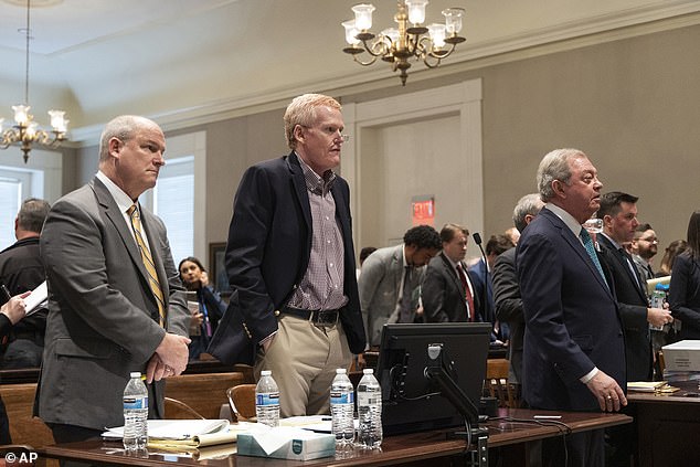 Murdaugh, center, and his legal team stand as Judge Clifton Newsman enters the courtroom for the double murder trial