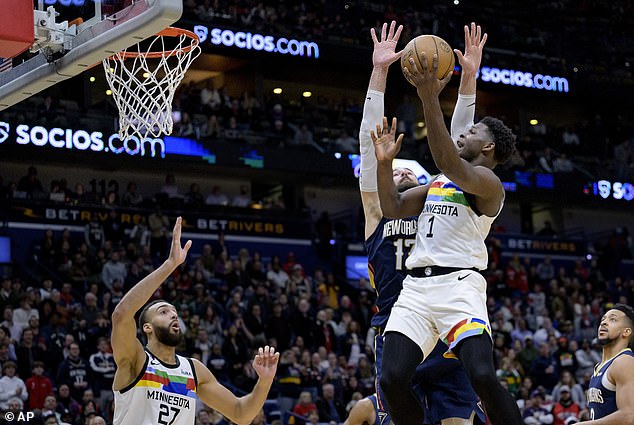 Timberwolves Anthony Edwards shoots at New Orleans center Jonas Valanciunas (17)