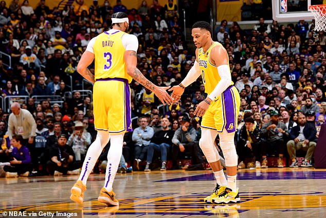 Russell Westbrook and Anthony Davis of LA Lakers high five during game against Spurs