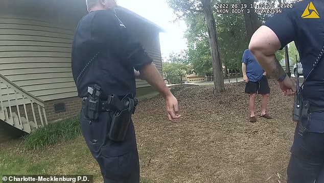 A resident leads authorities into the house after speaking with them for two minutes.