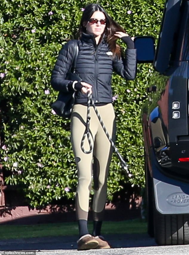 The Look: Shielding herself from the winter chill in a black quilted anorak, Kendall accessorized her ensemble with a great pair of dark sunglasses.