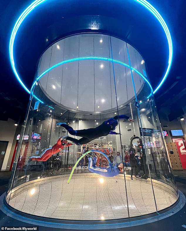 Pictured is an image of skydivers in a wind tunnel at iFly's indoor facility