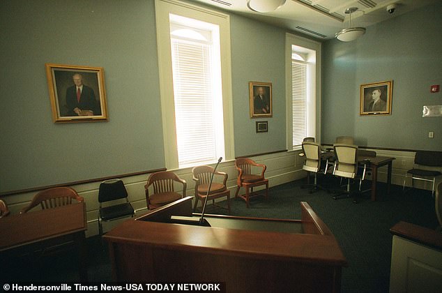 Portraits of former attorneys Randolph Murdaugh Sr., Randolph Murdaugh aka Buster Murdaugh, and Randolph Murdaugh III hang on the wall inside a courtroom at the Hampton County Courthouse