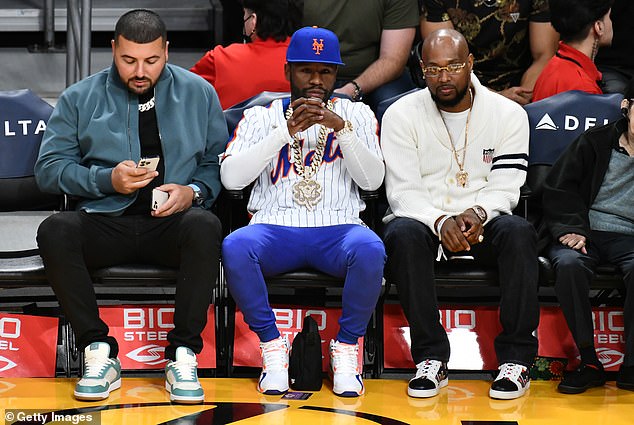 Famous faces: While former boxer Floyd Mayweather (center) was also in the crowd to watch