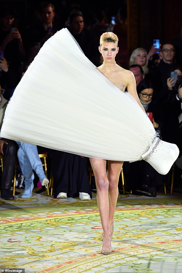 They say hems are rising again! Upsidedown dress wows guests at Paris