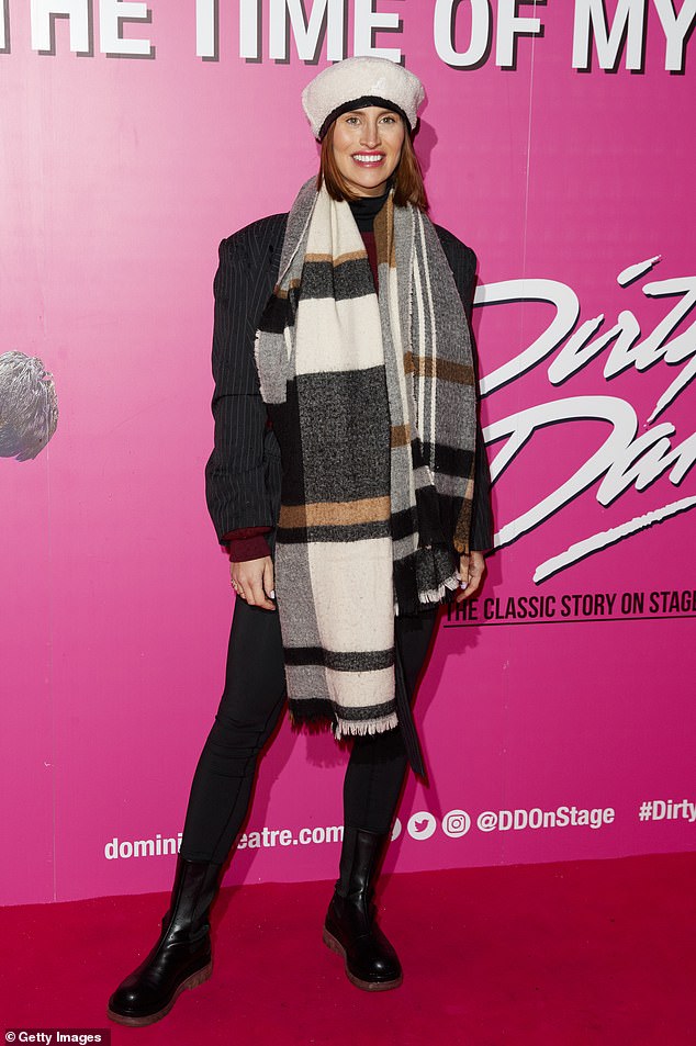 Resplendent: The reality star, 32, kept it cozy in a pale pink beret and oversized plaid scarf, teamed with a maroon jumper, striped blazer and leggings