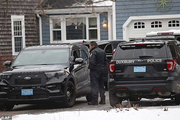 Duxbury Police work the scene where the two children were found dead and an injured infant on Wednesday.