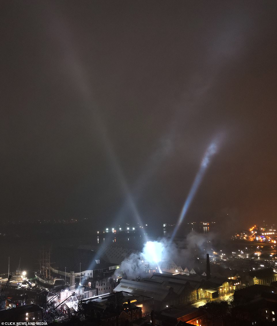 Dazzling searchlights were shot into the black night skies as cameramen filmed scenes for the new movie.