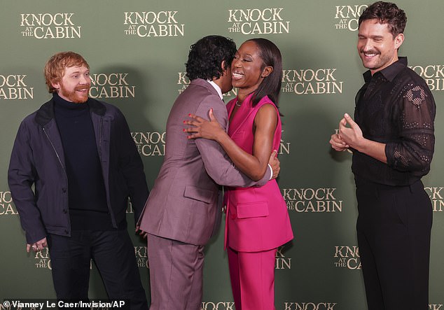 Hugs: Rupert and Ben smile as director M.Night greets Nikki with a hug at the special screening of the film.