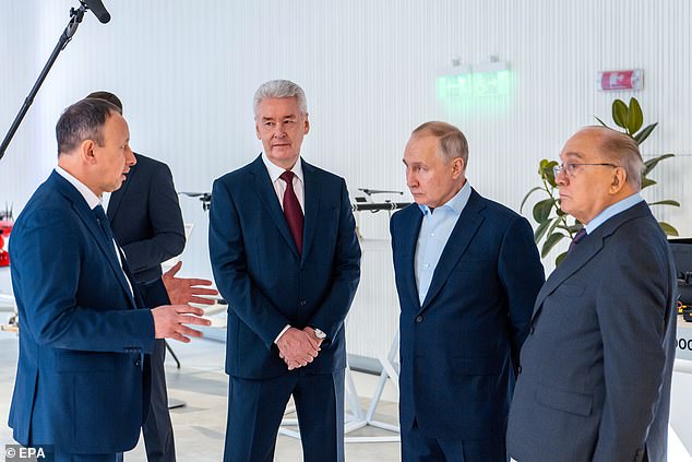 Vladimir Putin (2-R) stands next to Lomonosov Moscow State University Rector Viktor Sadovnichy (R) and Moscow Mayor Sergei Sobyanin (2-L) during their visit to Lomonosov Moscow State University during Day of Russian Students 'Tatiana's Day' in Moscow, Russia