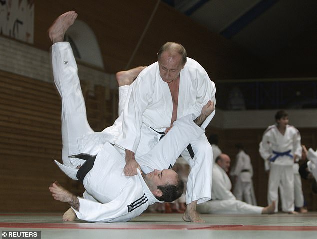 Putin shows off his judo skills at the Top Athletic School in Saint Petersburg, also in 2009.