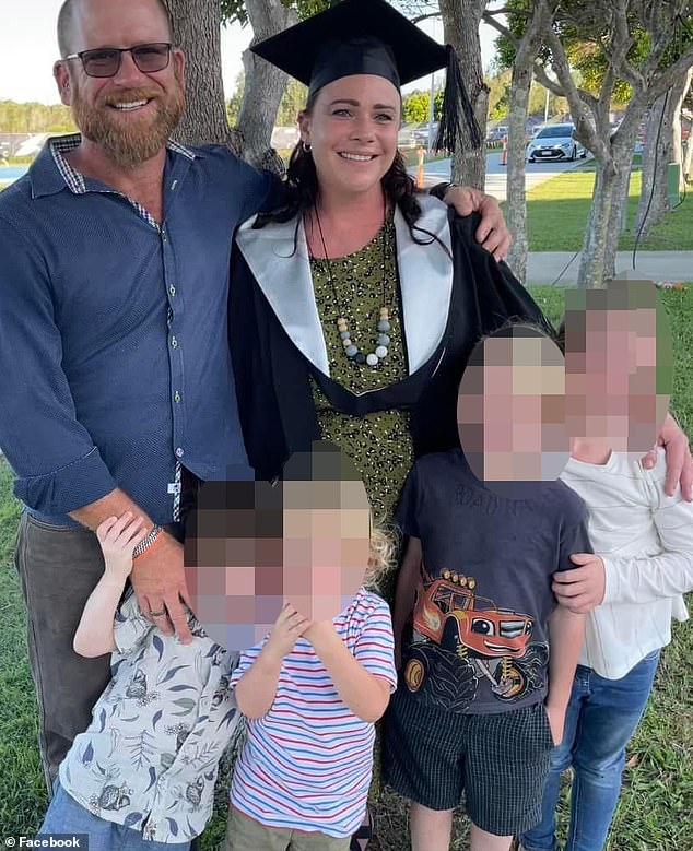 Ms. Watts with her husband and four children at the graduation ceremony for her nursing and midwifery degree (pictured)