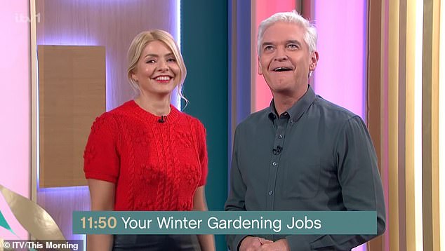 Awkward: Holly Willoughby laughed on Thursday when This Morning co-host Phillip Schofield reluctantly hosted a segment on 'trimming his bush'