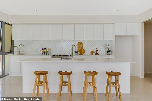 Purchased in 2015 for $1.485 million, the gorgeous architect-designed home could earn up to $220,000 in vacation rentals for an investor Pictured: Kitchen and breakfast bar