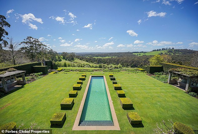 With a Tuscan-inspired design, the main residence is set amidst rolling pastures and surrounded by oak trees and gardens.  (Pictured: the pool and garden on top of the hill)