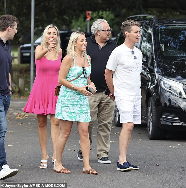 The rowdy group was seen leaving the seafood restaurant after a long lunch, with one of the guests pointing at paparazzi waiting in the parking lot.