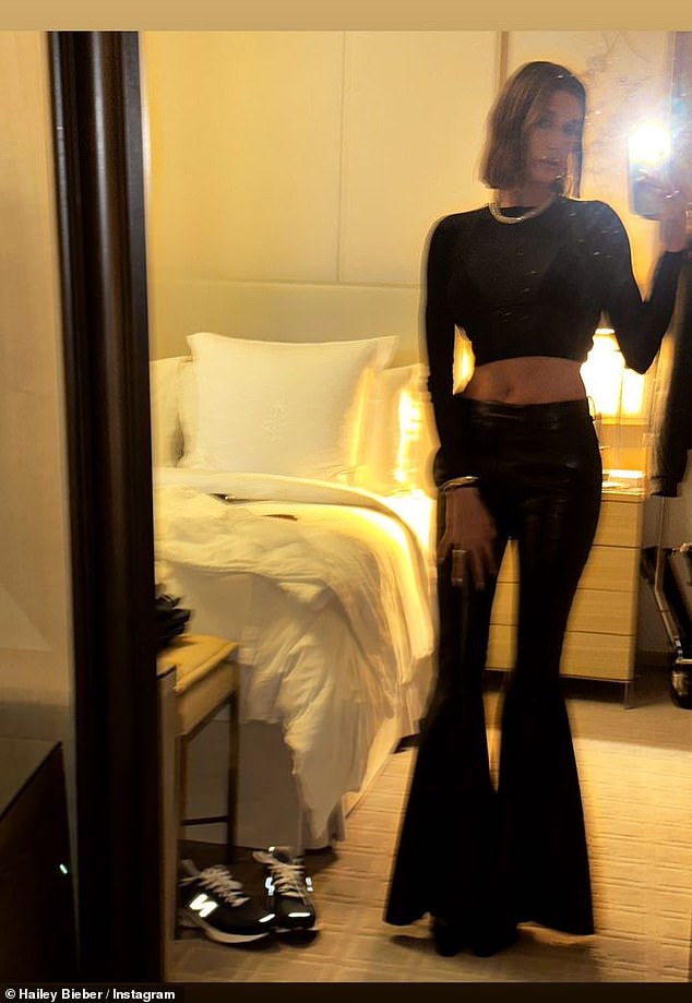 Fashion statement: The Rhode founder then uploaded a mirror selfie of herself to show off the entire outfit, revealing her leather flared pants