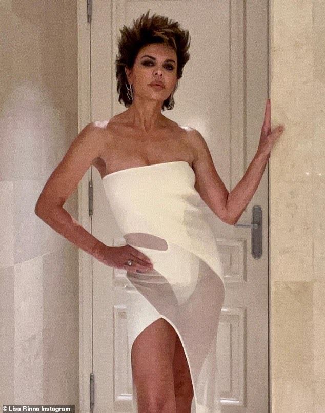 Cropped frame: The Real Housewives of Beverly Hills alum, 59, flaunted her slender figure as she posed in a strapless white Mugler gown