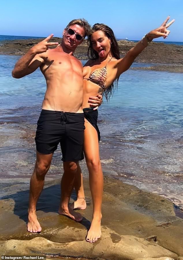 The 35-year-old personal trainer from Sydney showed off her stunning figure in a skimpy leopard print bikini top and black mini sarong as she snuggled up with her new boyfriend, Blake Hillen (left).