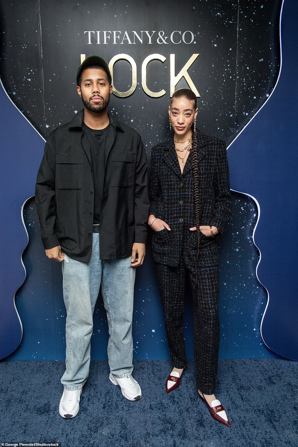 Runway Ready: Reign Judge looked runway ready in a blue and black tweed suit and colour-blocked leather loafers.  She was joined by singer-songwriter Mustafa Poet, who kept it casual and modern in a black windbreaker, baggy jeans and sneakers.