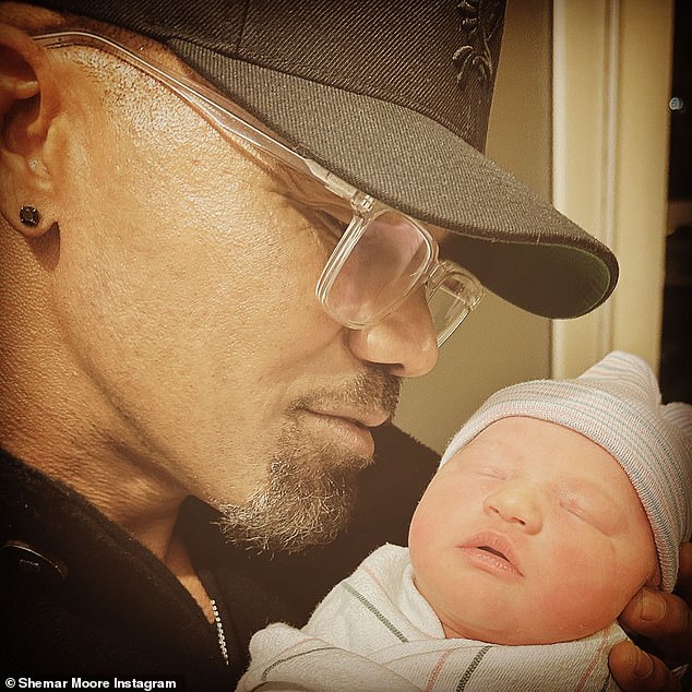 Ecstatic: Moore shared his excitement about fatherhood with a post shared to his Instagram account on Wednesday, where he was seen cradling his newborn daughter