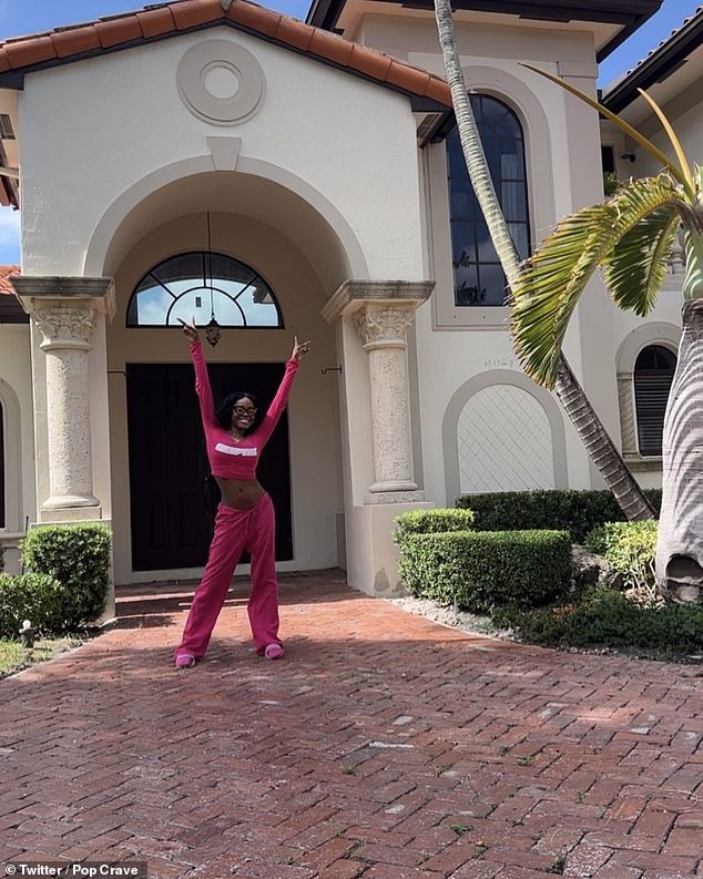 Banks is seen posing outside a house in Miami.  She tweeted: 'AZEALIA F****** BANKS GOT THE MANSION!!!!  WE DID IT JOE!!!'  She seems to be renting the house.