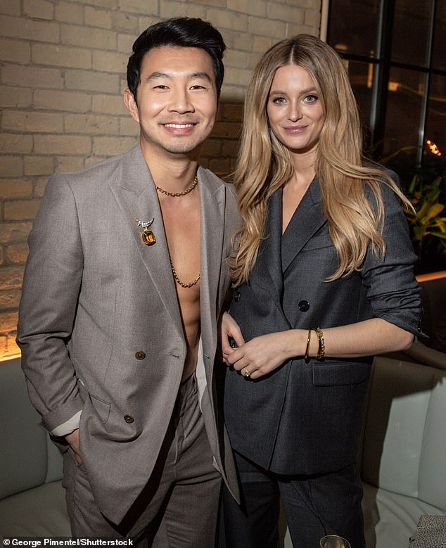 Striking: Simu and Kate Bock made quite the striking couple in their sleek gray suits.