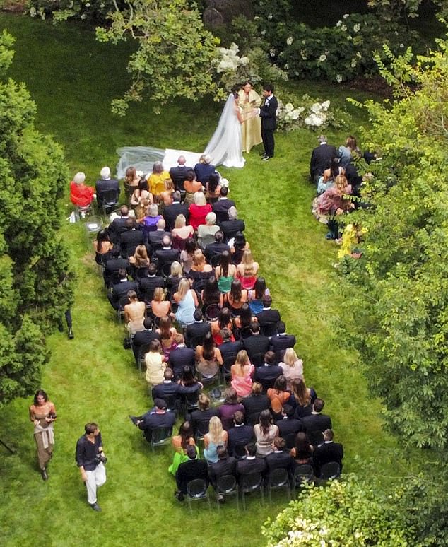 The couple looked delighted as they said their vows in front of friends and family at an outdoor venue at the venue.