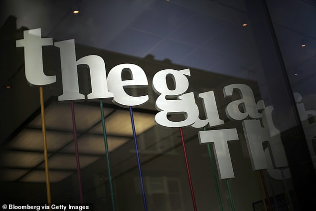 The Guardian newspaper company logo is displayed in the window of the Kings Place office complex