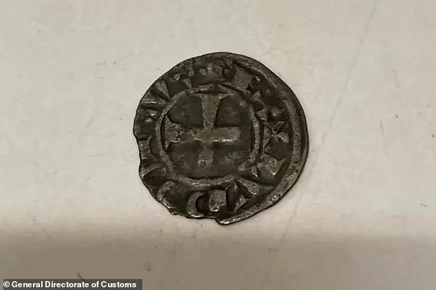 An 18th century coin that was part of the currency of France during the reign of King Louis IV.