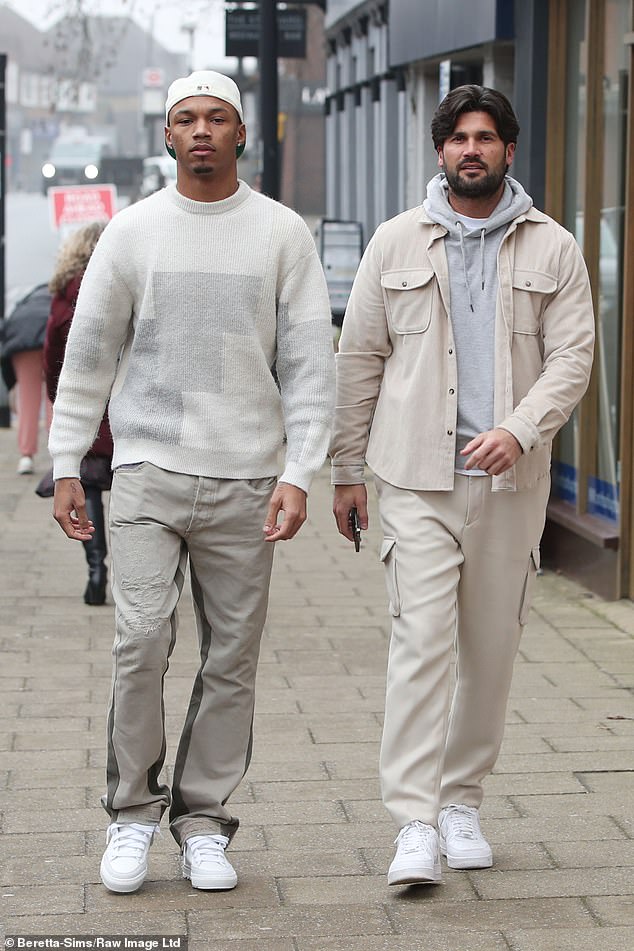 Matching: Roman and Dan Edgar wore matching beige outfits while filming