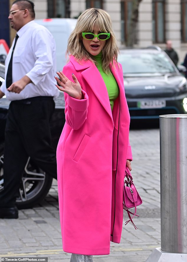 Playful: The 41-year-old Pussycat Doll turned heads as she showed off the amazing color-blocking ensemble.