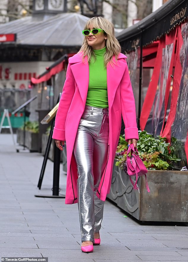 Chic: Ashley covered up in a bright pink coat and added inches to her enviable frame with matching shoes