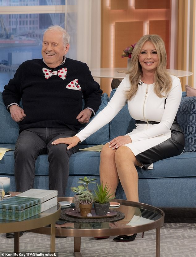 All smiles!  The beauty styled her long blonde locks into perfect waves as she appeared on the ITV show's blue sofa alongside Gyles Brandreth.