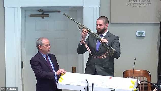 The prosecution's first witness, Sgt.  Daniel Greene shows the shotgun that he found Murdaugh holding at the scene that he took to his vehicle when Murdaugh appeared 