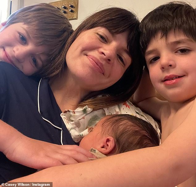 Family time: The news was accompanied by an Instagram album that included photos of newborn Frankie with his mother and two older brothers, Max, seven, and Henry, five.