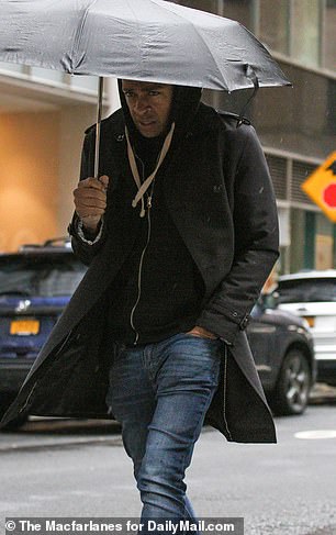 Earlier that morning, TJ, who was wearing a hoodie, jeans and boots, was seen leaving Robach's apartment.
