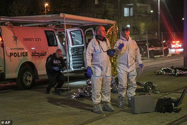 Forensic work on victims of a shooting near a synagogue in Jerusalem, Friday, January 27, 2023