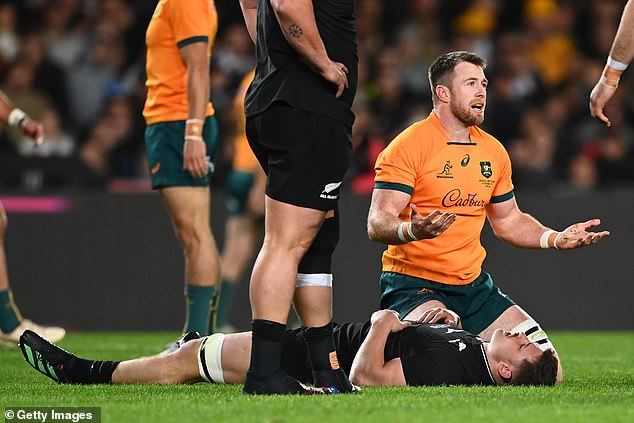 Drew Mitchell questioned how the new tackling rules will work, calling the RFU's move 'dramatic' (pictured, Wallabies' Jed Holloway reacts after picking up Dalton Papali'i from the All Blacks last year)